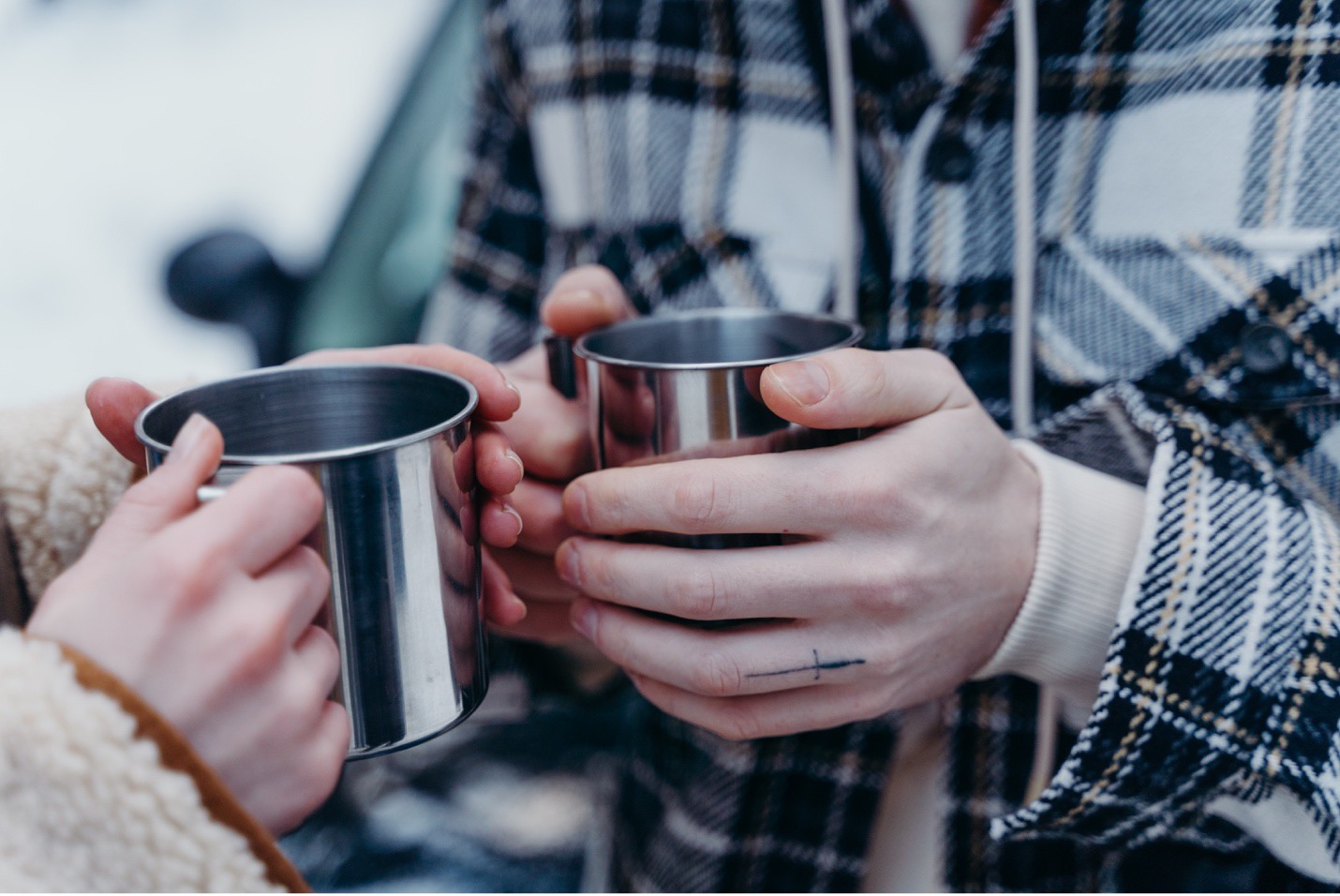 Two people holding mugs